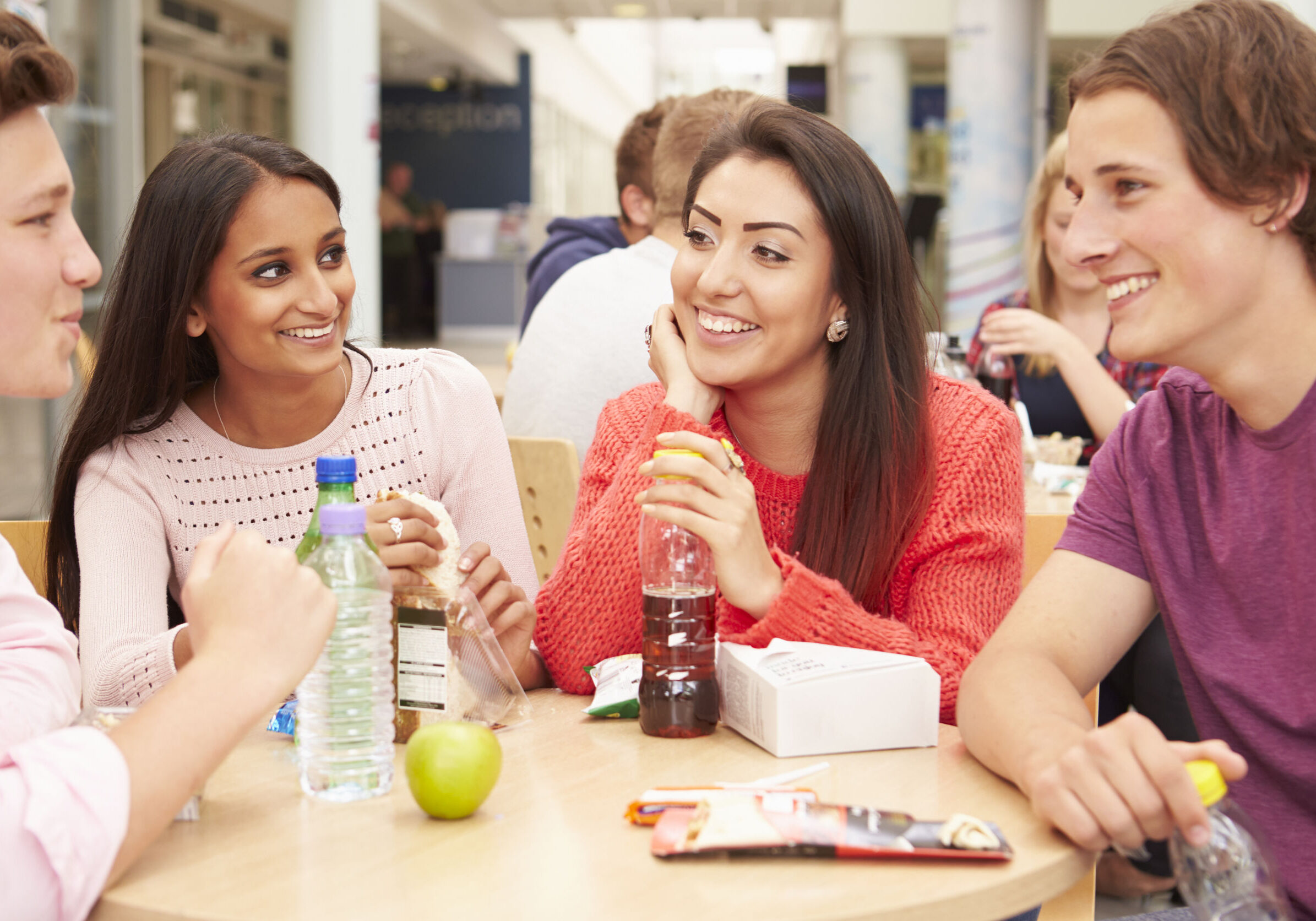 42311932 - group of college students eating lunch together